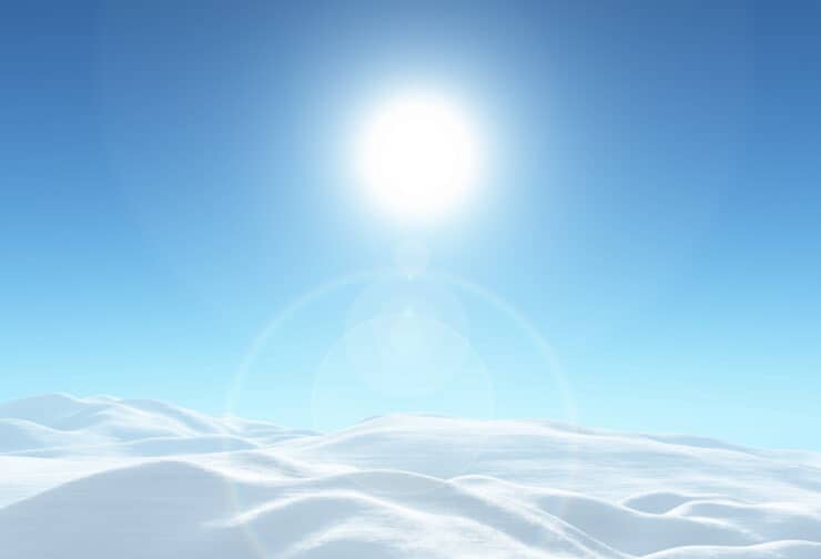 Sun in blue sky over snowy white hills; cover image for blog on how an awareness of leader character can strengthen teams.